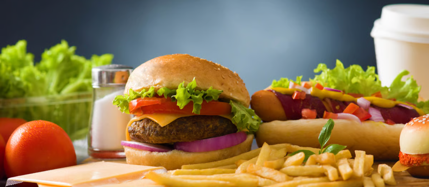 a burger and hot dog with fries - fast food