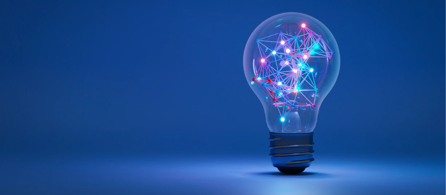 a light bulb with colorful lights - Innovation