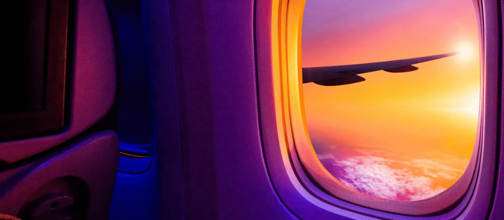 Top 10 Travel Trends for 2025 You Shouldn’t Miss 4 a view of the sunset from a plane window during travel